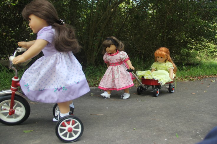 Summer for Samanta and Susan. The dolls loved playing with the tricyle and the wagon- a 18" doll adventure by Stitching with Elli