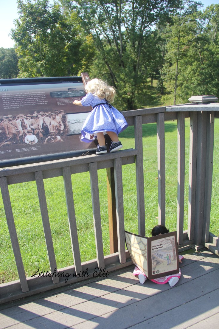 Reading the signs and working on their junior ranger booklet- a 18" doll adventure by Stitching with Elli