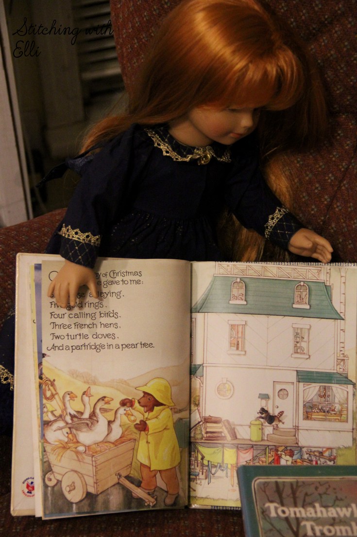 The dolls read Christmas stories- by stitching with Elli