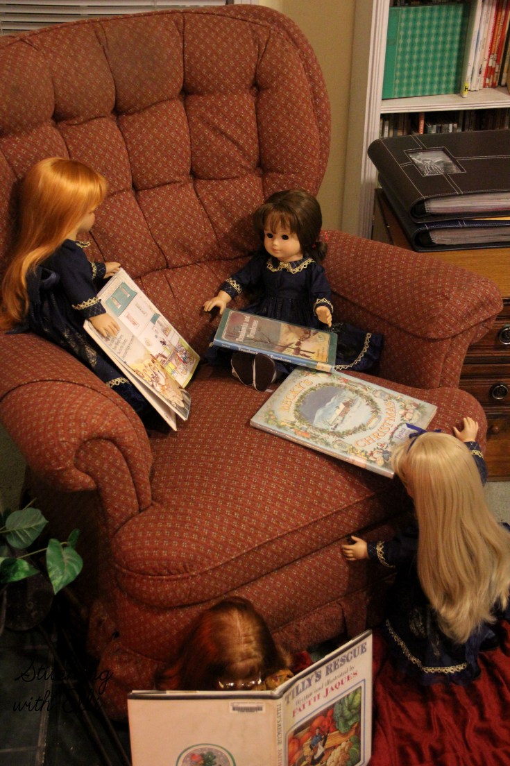 Reading Christmas books by the fire- Christmas with American Girls by Stitching with Elli