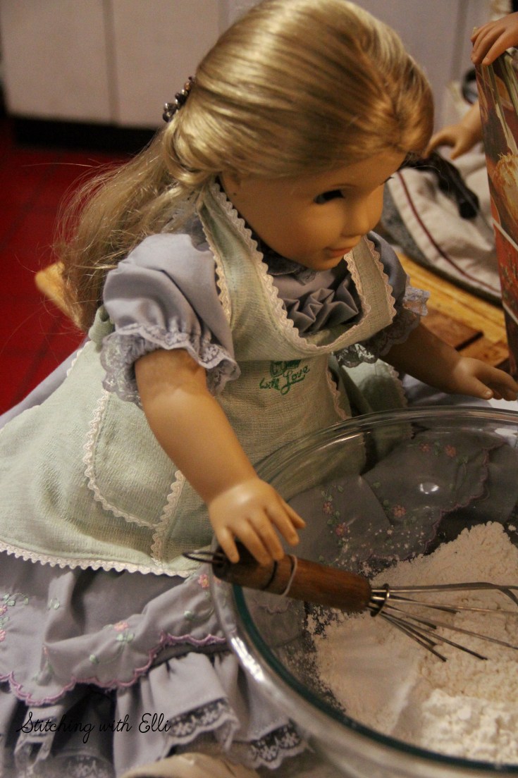 The great thanksgiving pie bake! Elizabeth whisks up the flour to make sure there are no lumps- a Thanksgiving story with American girl dolls by stitching with Elli