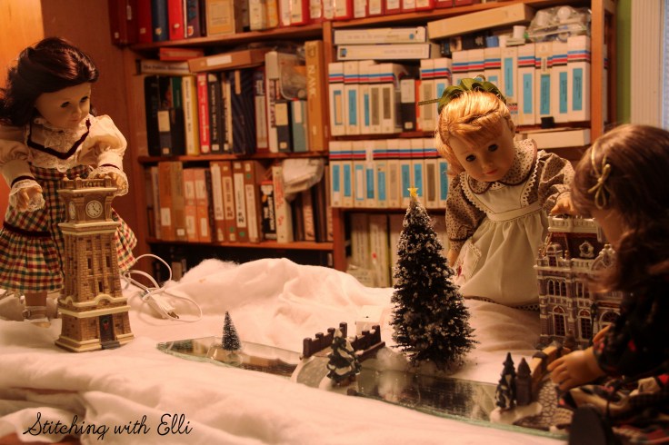 Setting up a Christmas village! Susan and Maryellen are hard at work- by Stitching with Elli