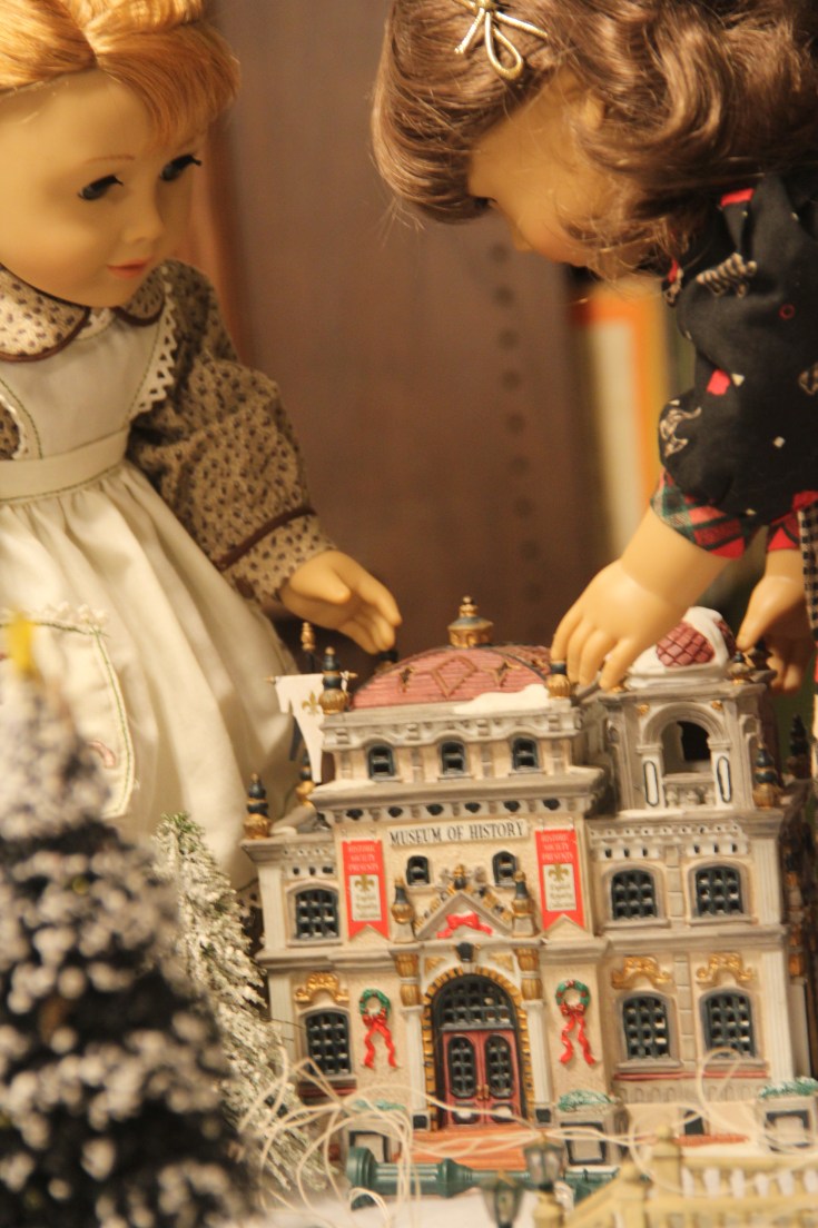 Setting up a Christmas village! Susan and Maryellen are hard at work- by Stitching with Elli