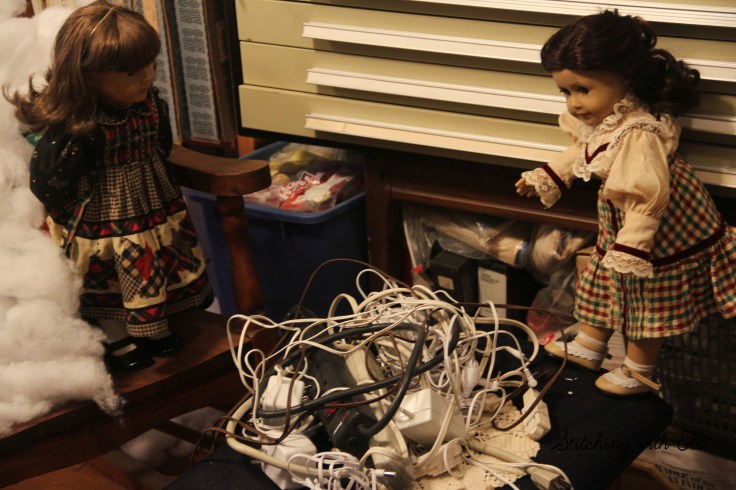 Setting up a Christmas village..what are we supposed to do with all these cords??- by Stitching with Elli