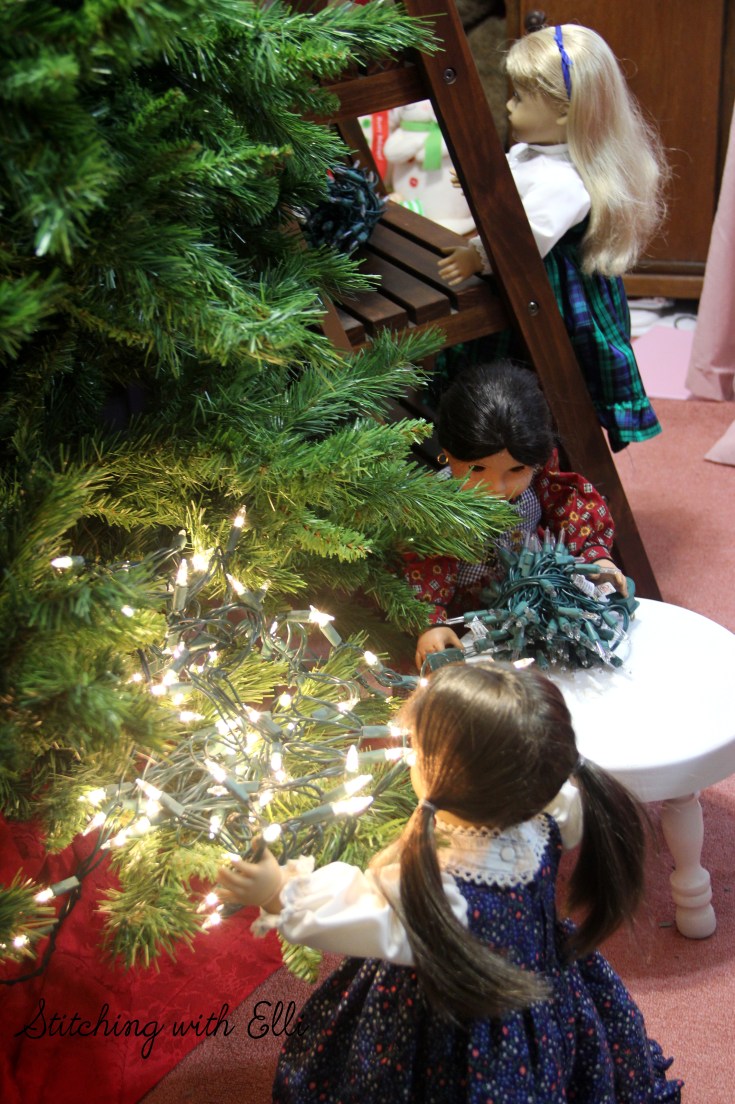 Briget puts the lights on the tree- an American girl  Christmas photostory by Stitching with Elli