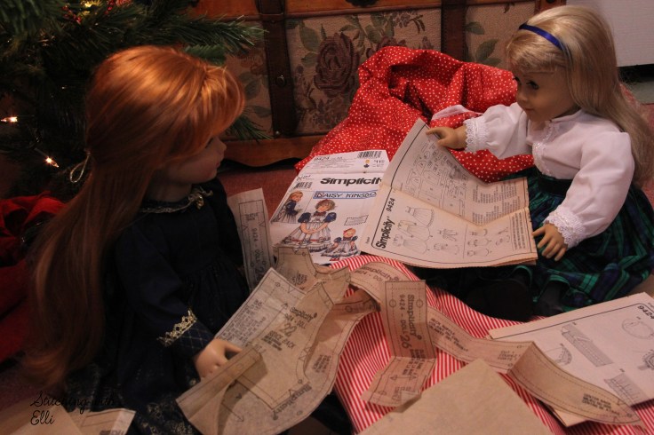 The dolls are sewing a dress for a Christmas present-  by Stitching with Elli