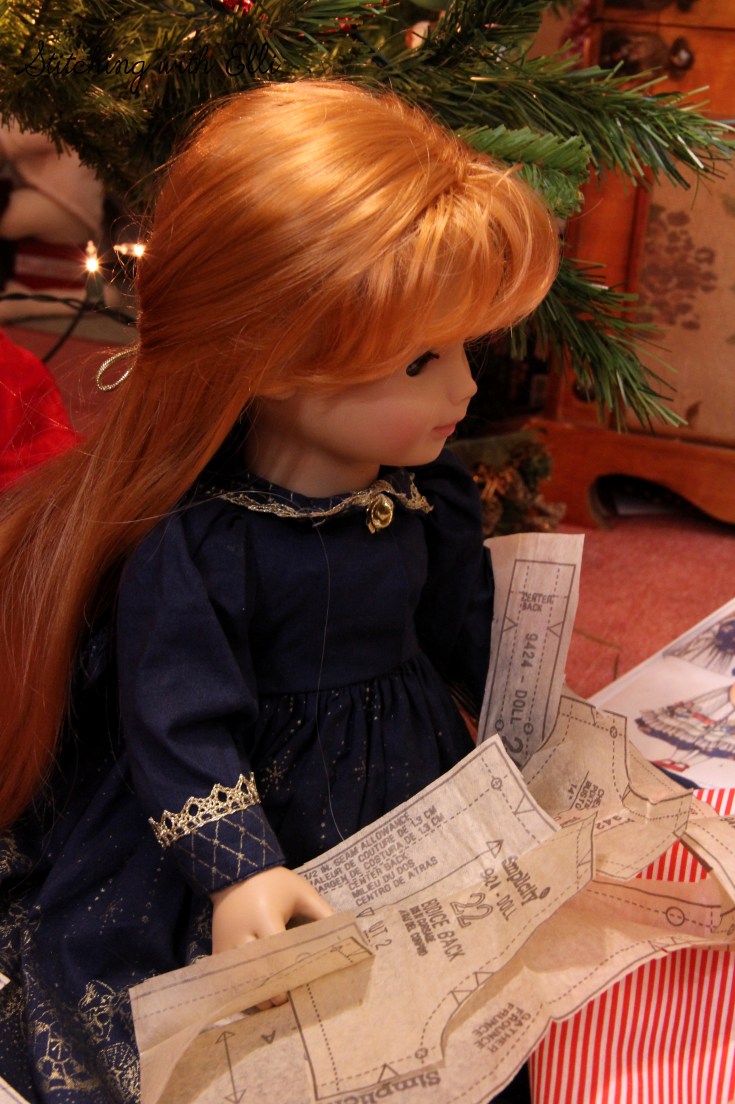 The dolls are sewing a dress for a Christmas present-  by Stitching with Elli