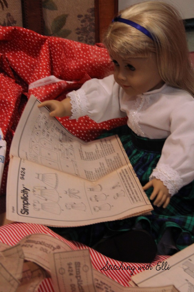 The dolls are sewing a dress for a Christmas present-  by Stitching with Elli