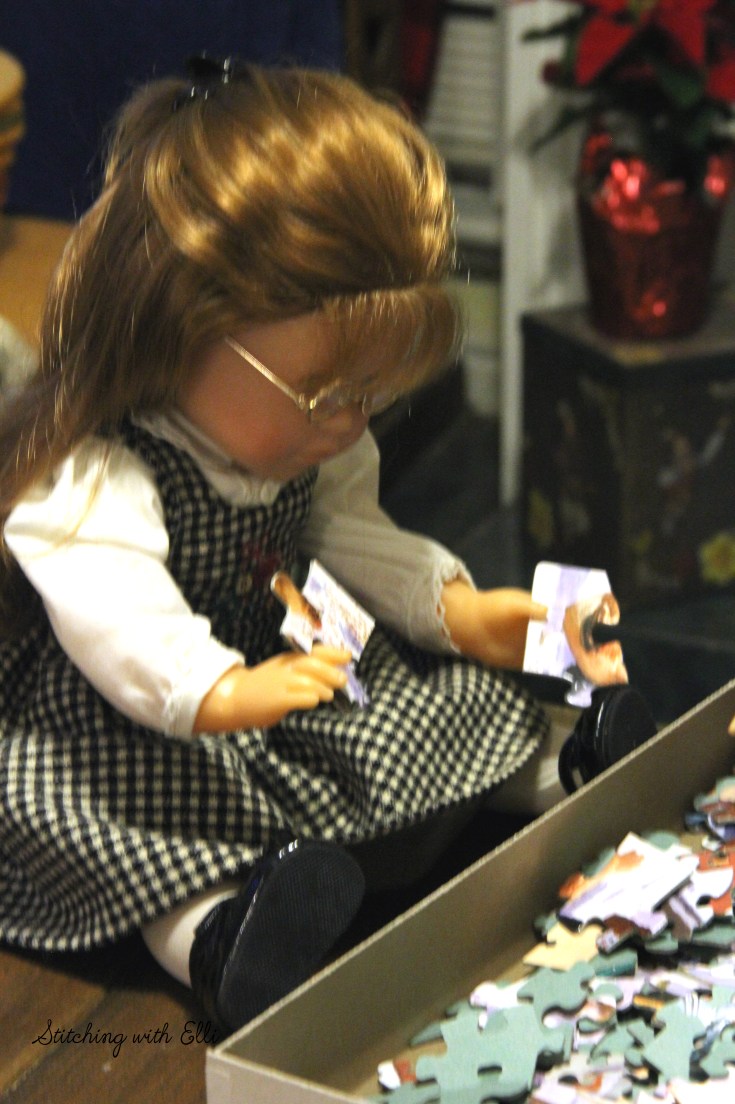 Spending time together working on a puzzle is a fun thing to do around Christmas time- by Stitching with Elli