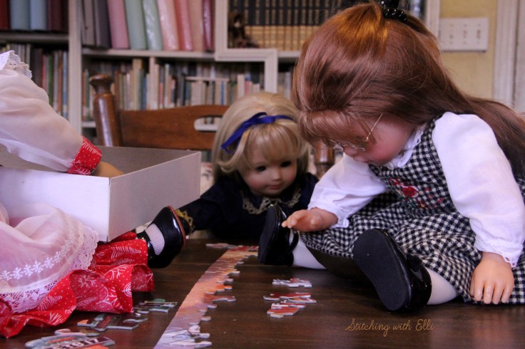 Spending time together working on a puzzle is a fun thing to do around Christmas time- by Stitching with Elli