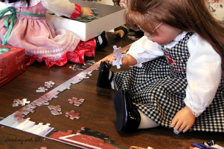 Spending time together working on a puzzle is a fun thing to do around Christmas time- by Stitching with Elli