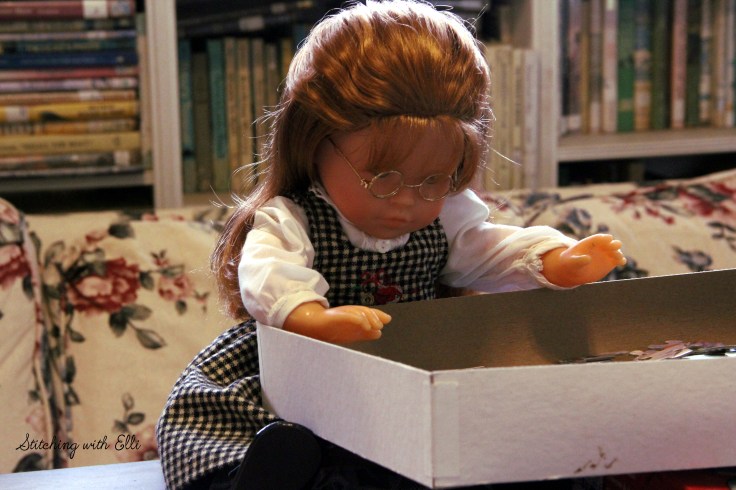 Spending time together working on a puzzle is a fun thing to do around Christmas time- by Stitching with Elli