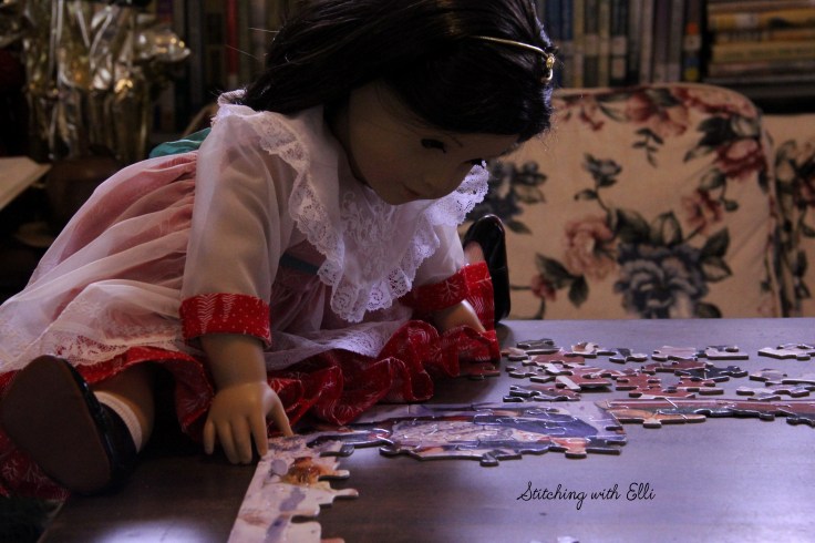 Spending time together working on a puzzle is a fun thing to do around Christmas time- by Stitching with Elli