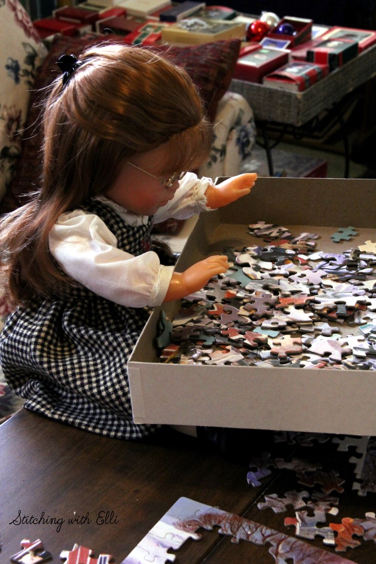 Spending time together working on a puzzle is a fun thing to do around Christmas time- by Stitching with Elli