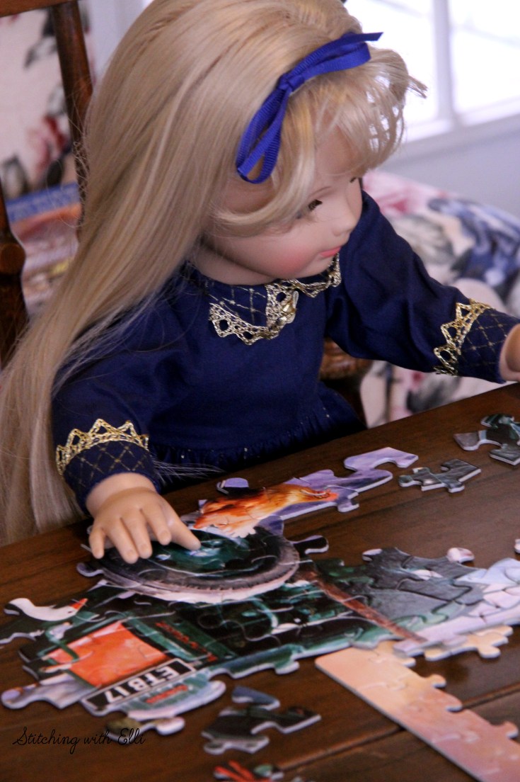 Spending time together working on a puzzle is a fun thing to do around Christmas time- by Stitching with Elli