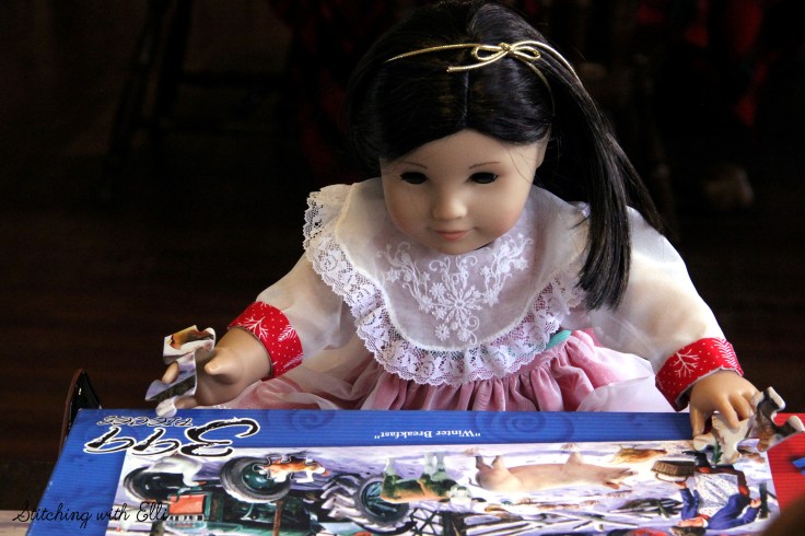 Spending time together working on a puzzle is a fun thing to do around Christmas time- by Stitching with Elli