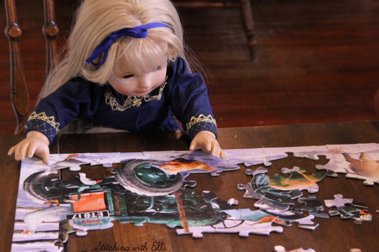 Spending time together working on a puzzle is a fun thing to do around Christmas time- by Stitching with Elli