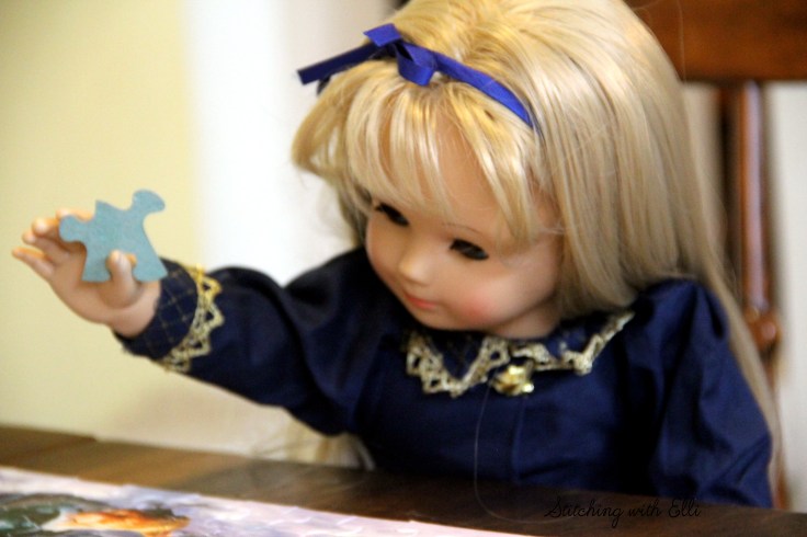 Spending time together working on a puzzle is a fun thing to do around Christmas time- by Stitching with Elli