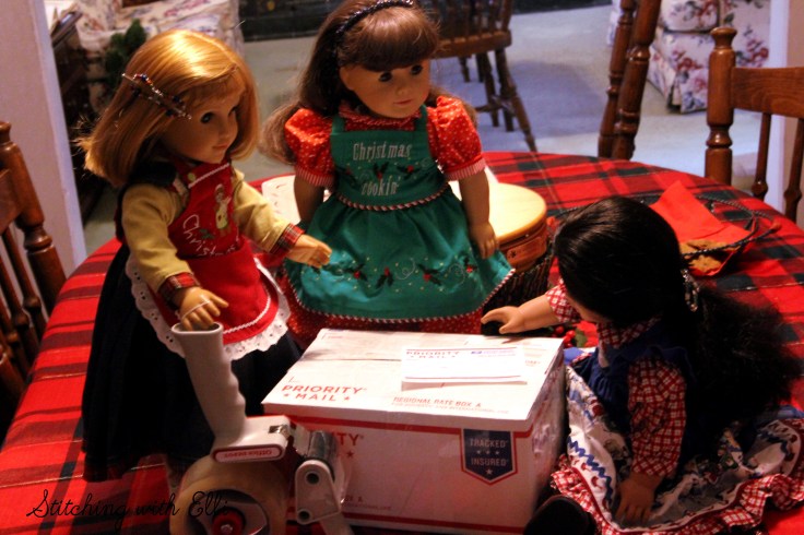 Packing up cookies to go to the soldiers for Christmas- American Girl photo story by Stitching with Elli
