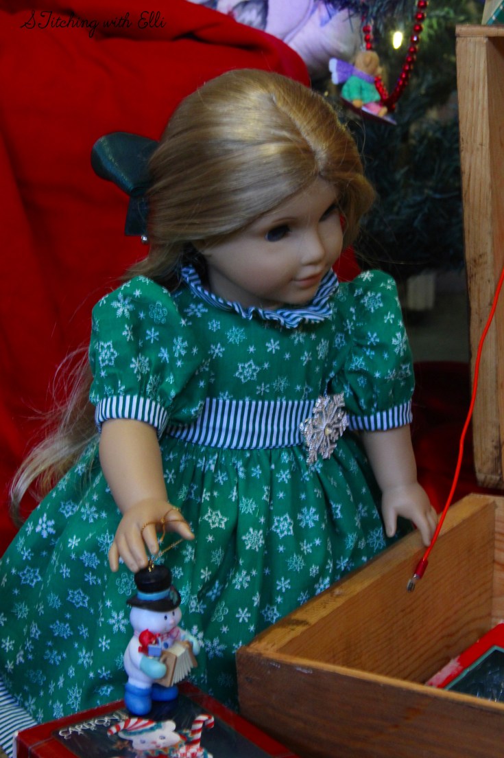 Elizabeth and Debbie help hang the ornaments on the tree- an American girl story by Stitching with Elli