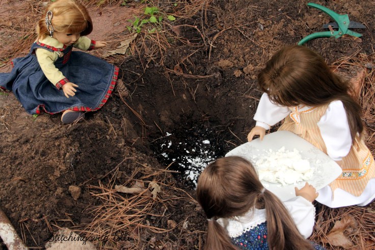 Adding egg shells for fertilizer  to the hole, the dolls plant a garden- a 18" doll adventure by Stitching with Elli