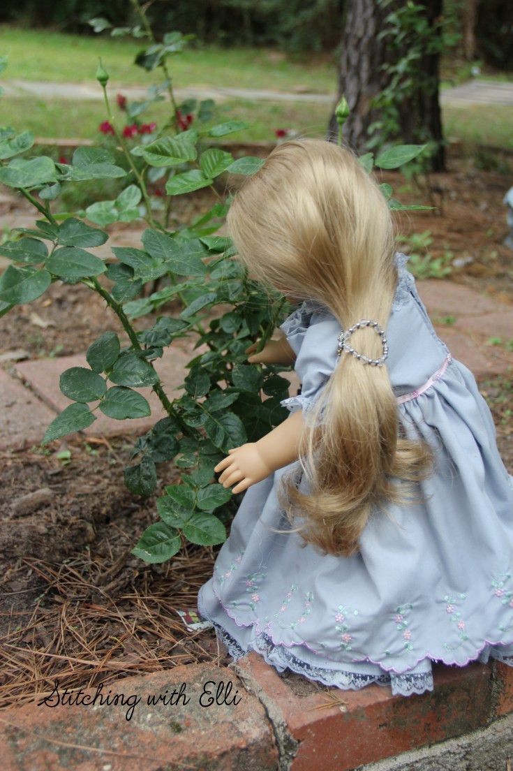 Elizabeth is working in the rose garden- see the story on stitchingwithelli.com