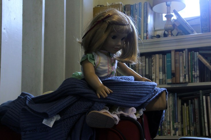 Nellie is helping to pack the suitcase