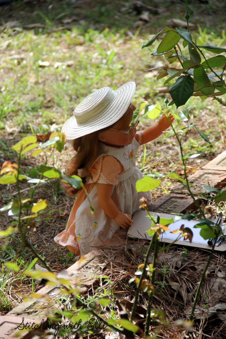 Ellen inspects the roses- see the whole story by www.stitchingwithelli.com