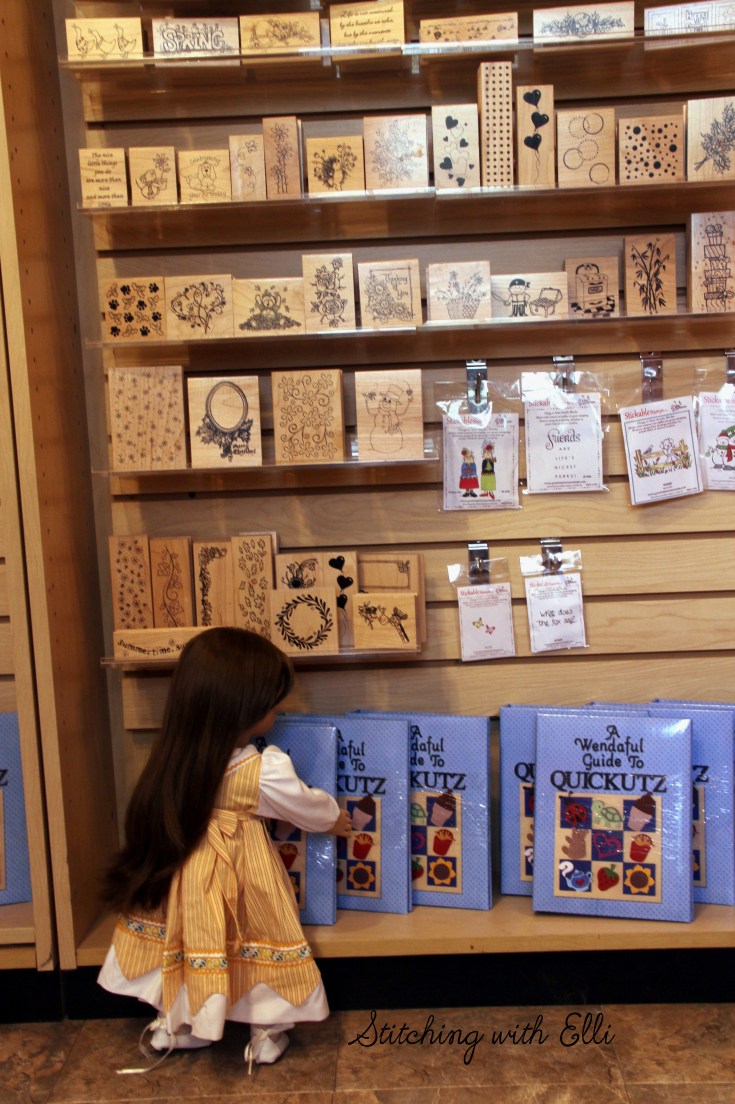 Dolls in a scrapbooking store- see the whole story on www.stitchingwithelli.com