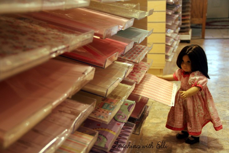 Dolls in a scrapbooking store- see the whole story on www.stitchingwithelli.com