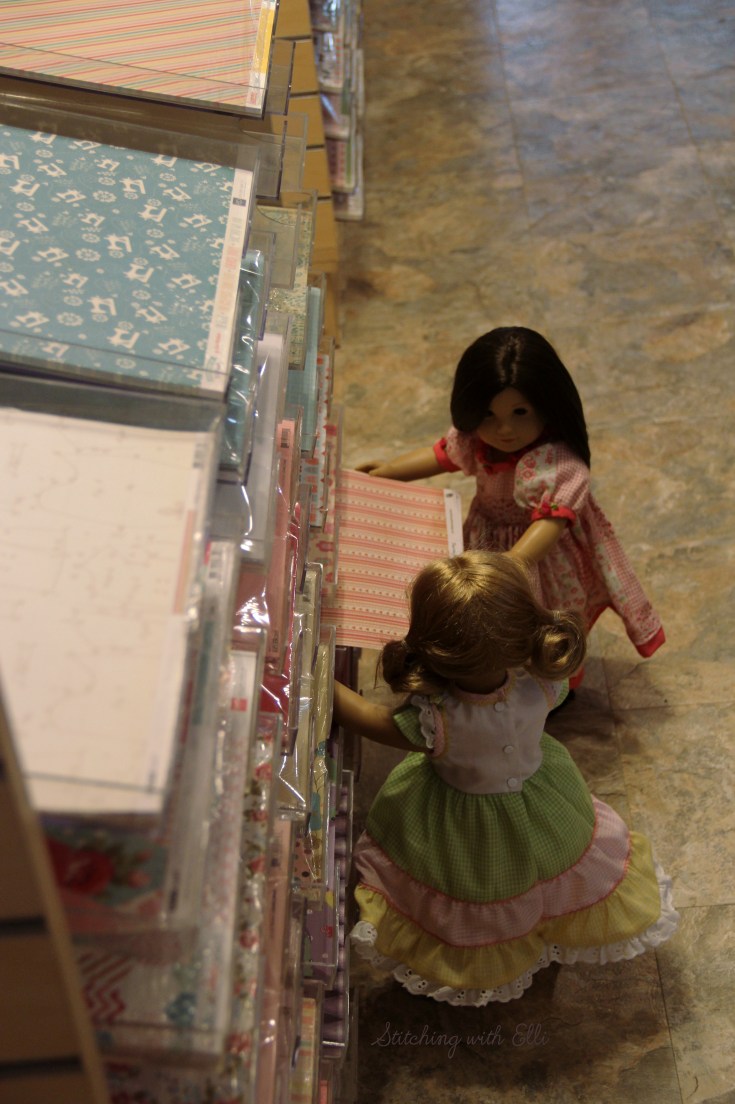 Dolls in a scrapbooking store- see the whole story on www.stitchingwithelli.com