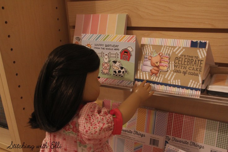 Dolls in a scrapbooking store- see the whole story on www.stitchingwithelli.com