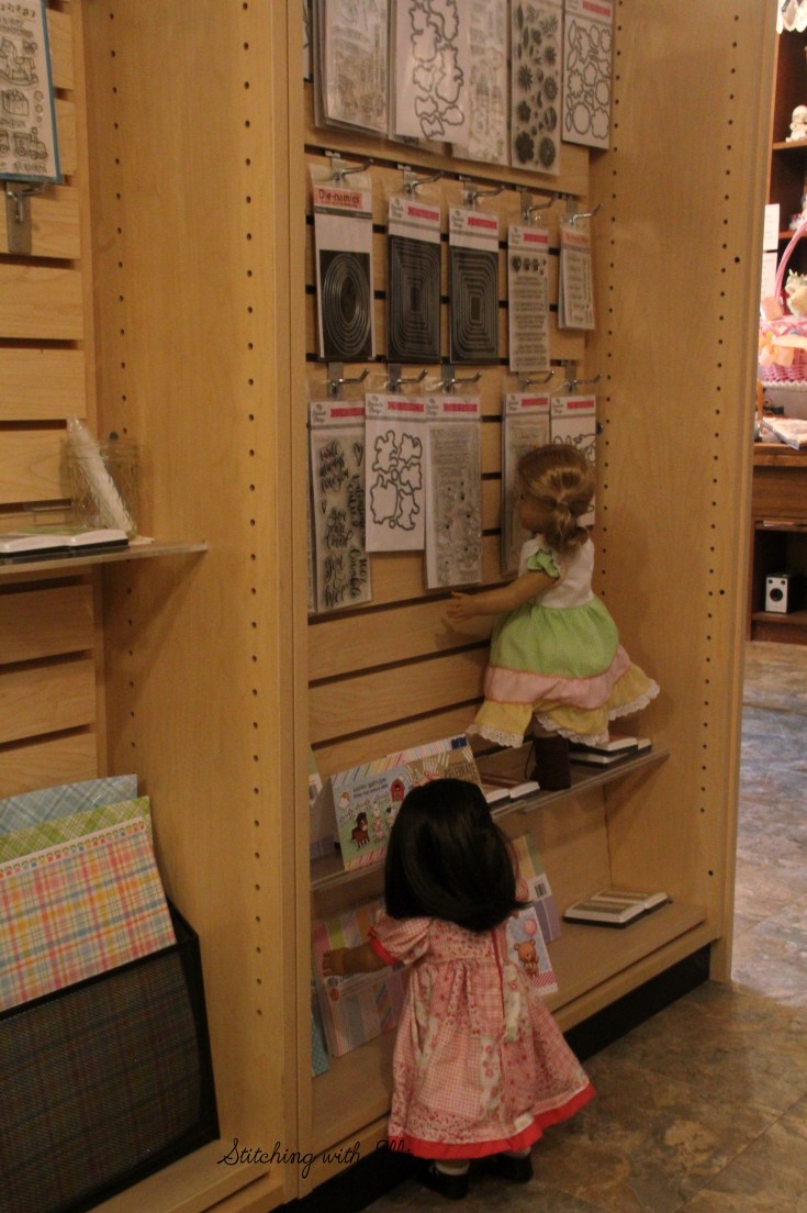 Dolls in a scrapbooking store- see the whole story on www.stitchingwithelli.com
