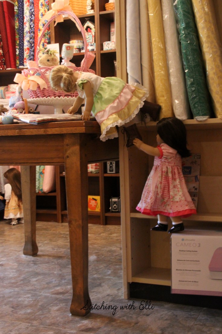 Dolls in a scrapbooking store- see the whole story on www.stitchingwithelli.com